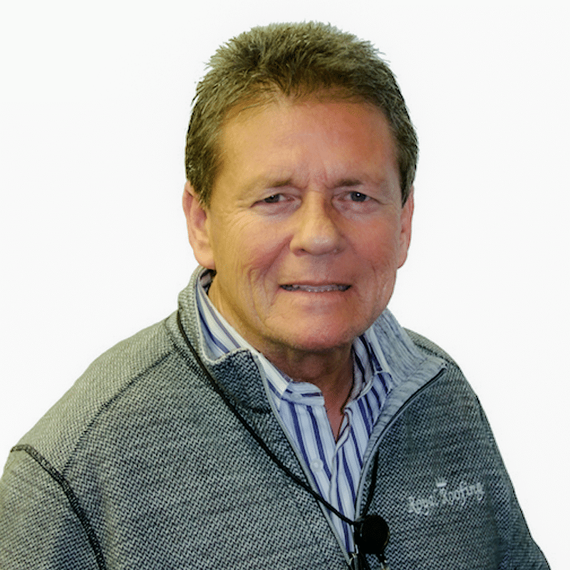 Steve Pinkus Headshot A middle-aged man with short brown hair wearing a gray zip-up sweater over a striped shirt, smiling slightly at the camera against a white background.