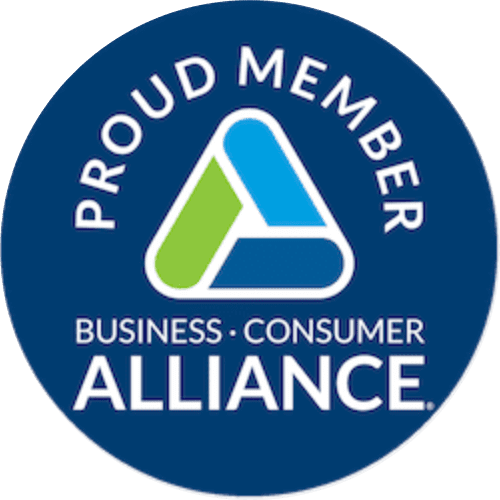 Blue circular badge with the words "Proud Member Business · Consumer Alliance" and a triangular logo in the center.